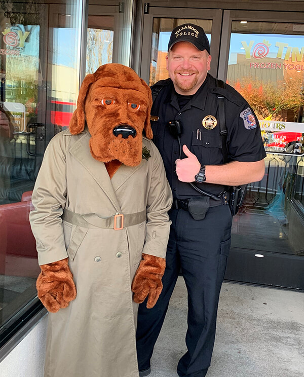 Sgt. Troxel with McGruff the Crime Dog during Halloween downtown.